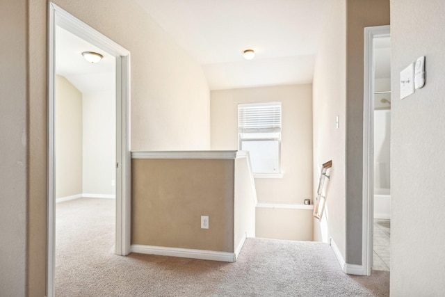 2812 Merry View Ln, Fort Worth, TX 76120 - hallway featuring baseboards, an upstairs landing, and carpet