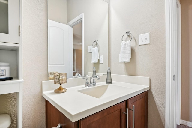 2812 Merry View Ln, Fort Worth, TX 76120 - bathroom featuring a textured wall and vanity
