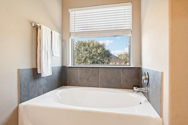 bathroom with a tub