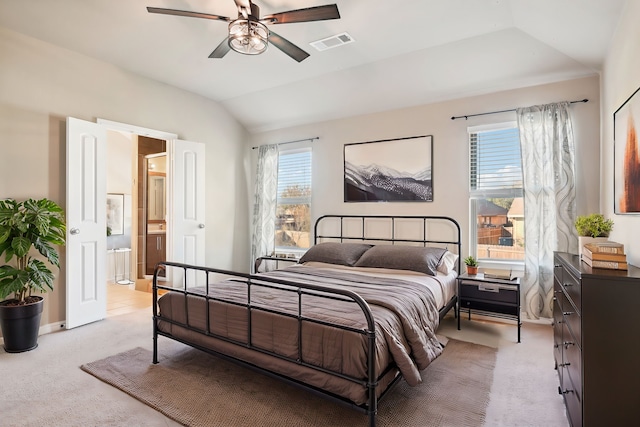 2812 Merry View Ln, Fort Worth, TX 76120 - bedroom featuring light colored carpet, visible vents, lofted ceiling, and ensuite bathroom
