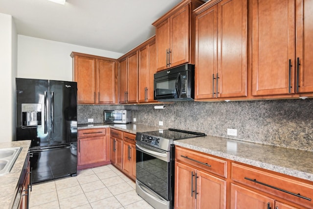 2812 Merry View Ln, Fort Worth, TX 76120 - kitchen with decorative backsplash, light tile patterned flooring, black appliances, and brown cabinets