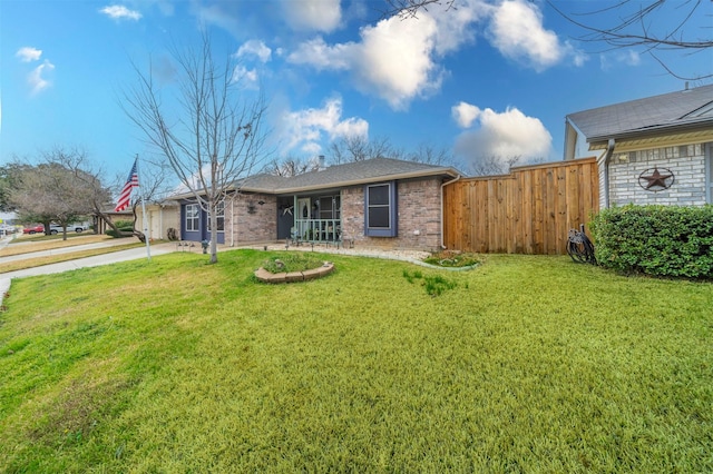 rear view of property with a yard