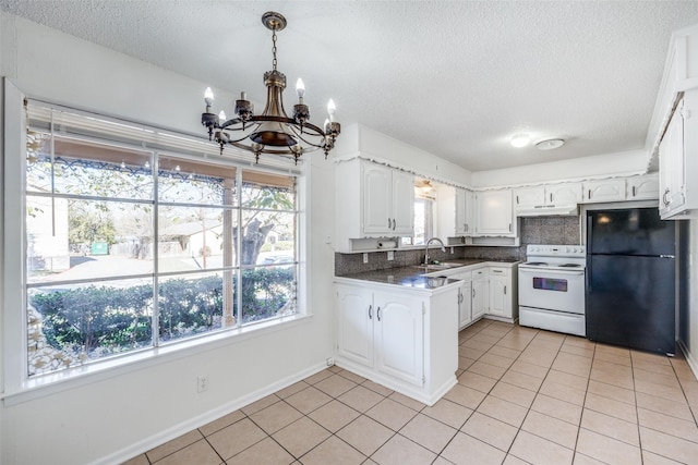 kitchen with white cabinets, black refrigerator, sink, white electric stove, and light tile patterned floors