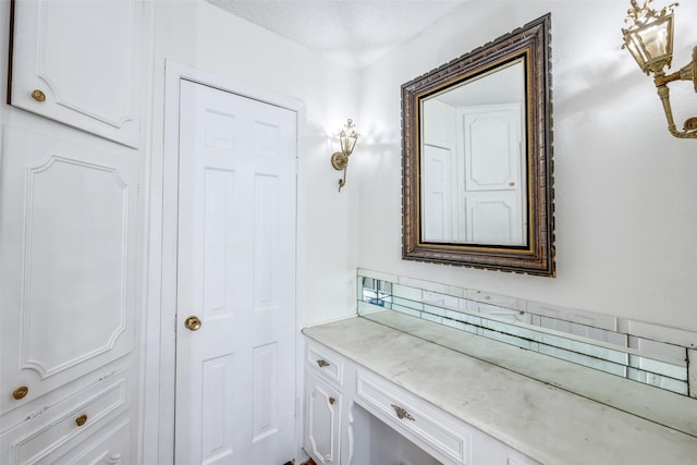 bathroom featuring vanity and a textured ceiling