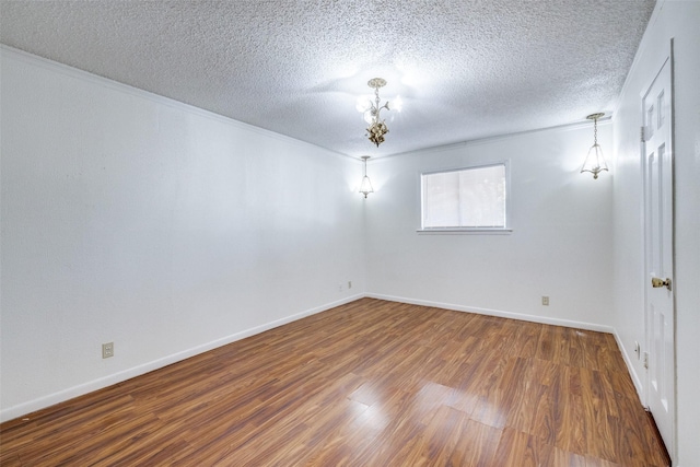 unfurnished room with dark hardwood / wood-style floors and a textured ceiling