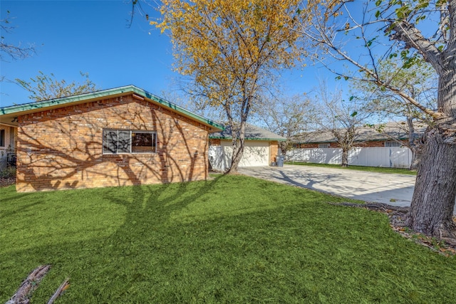 exterior space featuring a front yard and a garage