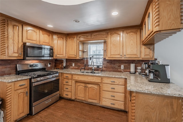 5613 Graham St, Sansom Park, TX 76114 - kitchen with stainless steel appliances, a sink, backsplash, and recessed lighting