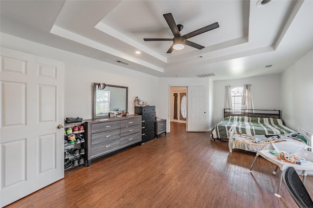 5613 Graham St, Sansom Park, TX 76114 - bedroom featuring a raised ceiling, dark wood-style floors, and a ceiling fan