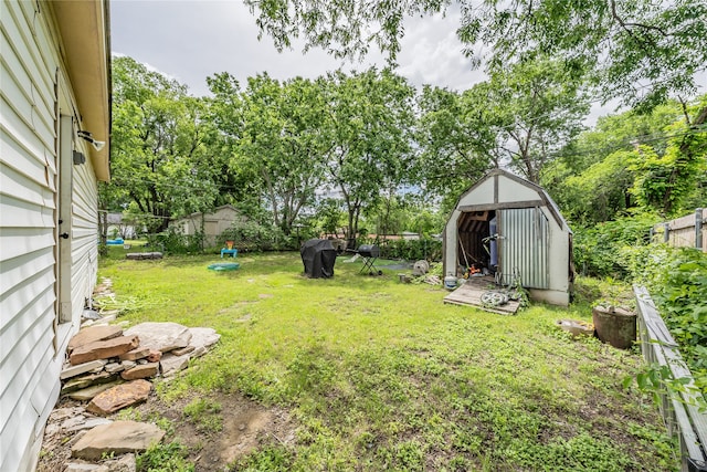 5613 Graham St, Sansom Park, TX 76114 - view of yard featuring a storage unit and an outdoor structure