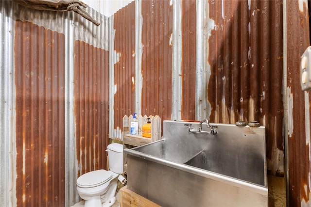 bathroom with toilet and sink