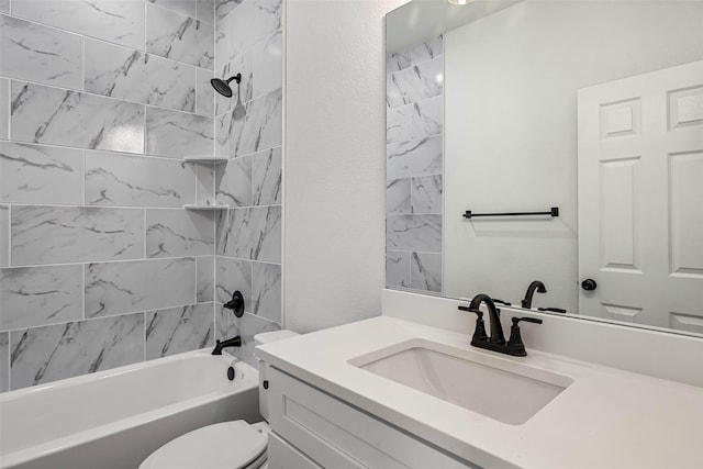 full bathroom featuring vanity, toilet, and tiled shower / bath