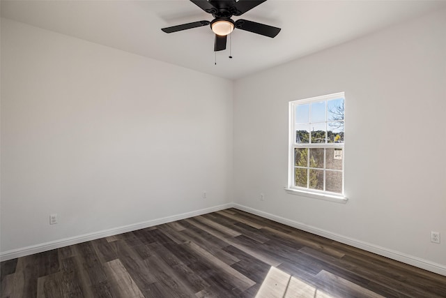 unfurnished room with ceiling fan and dark hardwood / wood-style floors