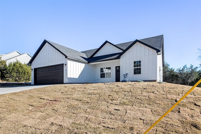 modern farmhouse style home featuring a garage