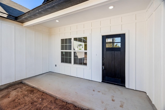 property entrance featuring a patio area