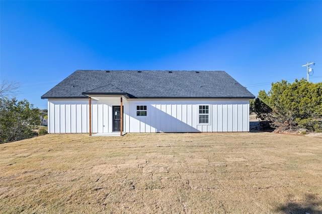 back of house featuring a yard