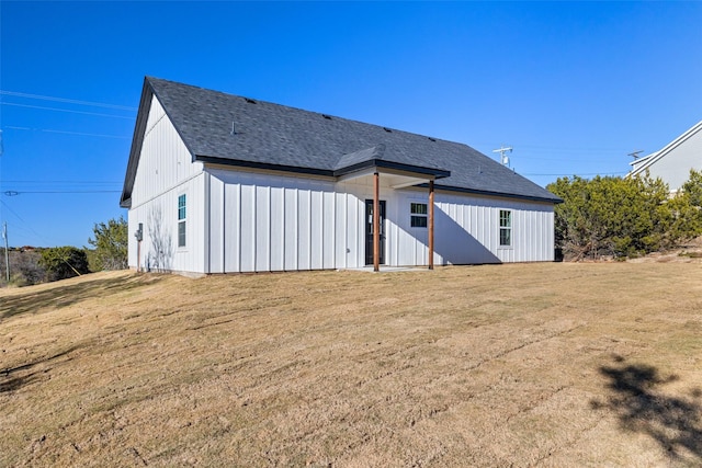 rear view of house with a lawn