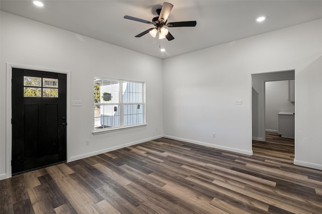 foyer entrance featuring ceiling fan and dark wood-type flooring