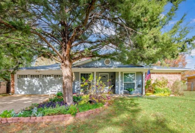 view of front of home featuring a garage and a front lawn