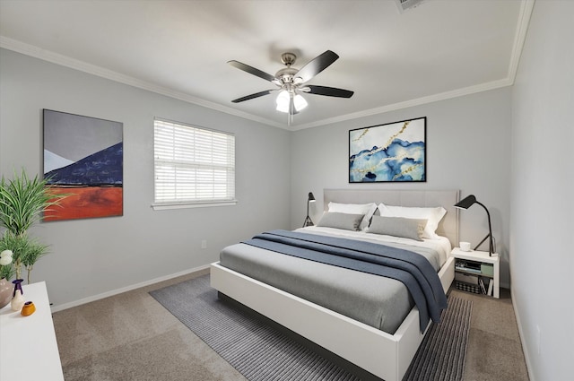 bedroom with ceiling fan, crown molding, and carpet floors