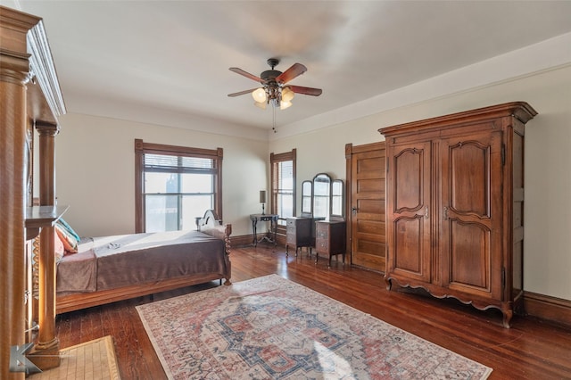 bedroom featuring ceiling fan and dark hardwood / wood-style flooring