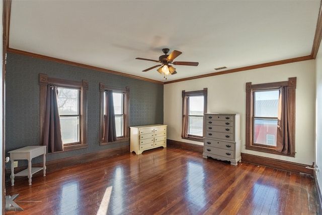 unfurnished bedroom featuring ceiling fan, ornamental molding, and dark hardwood / wood-style flooring