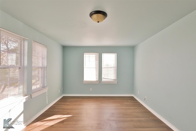 spare room featuring dark hardwood / wood-style flooring