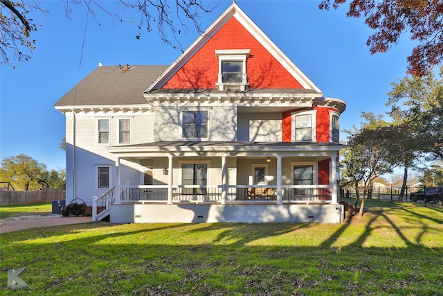 view of front of home with covered porch and a front yard