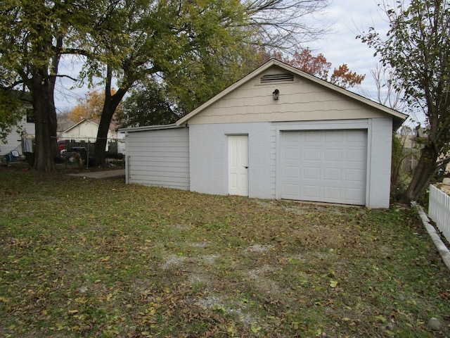 garage featuring a yard