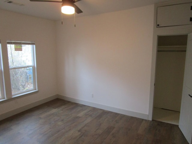 unfurnished bedroom with hardwood / wood-style floors and a closet