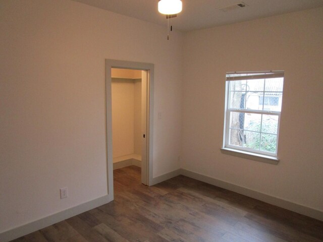 spare room featuring dark hardwood / wood-style flooring