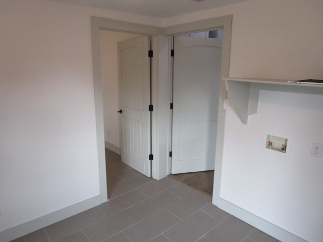 washroom featuring washer hookup and tile patterned floors