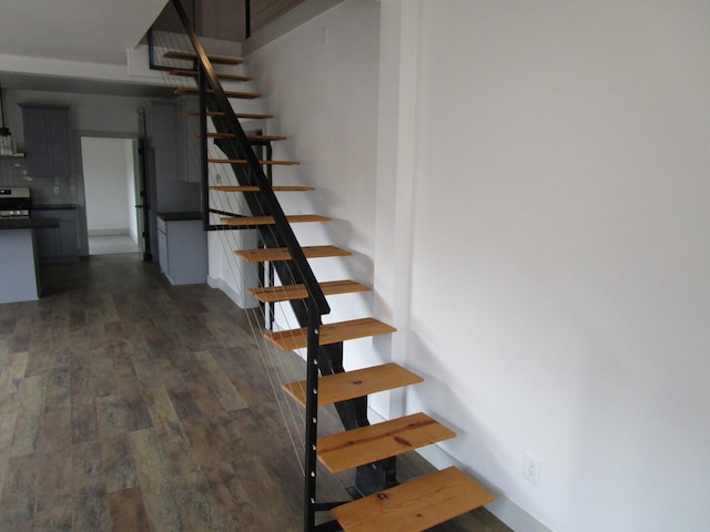 stairs with wood-type flooring