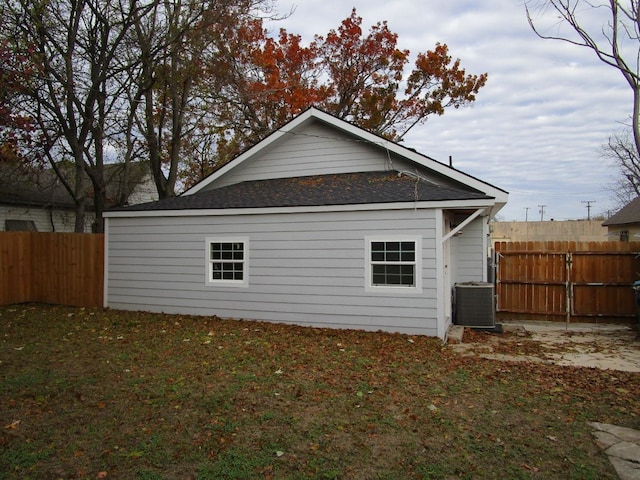 rear view of property featuring central air condition unit