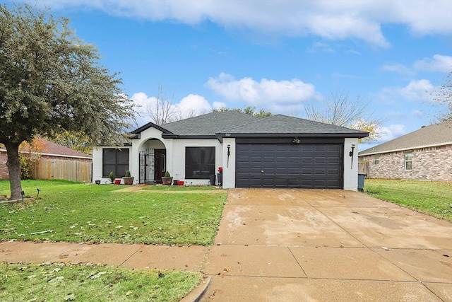 ranch-style house featuring a front yard and a garage