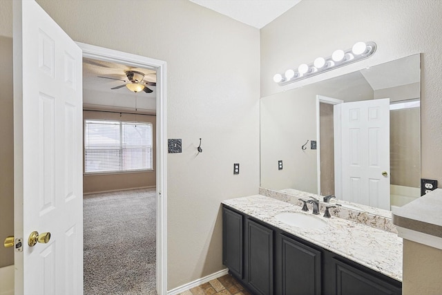 bathroom with ceiling fan and vanity