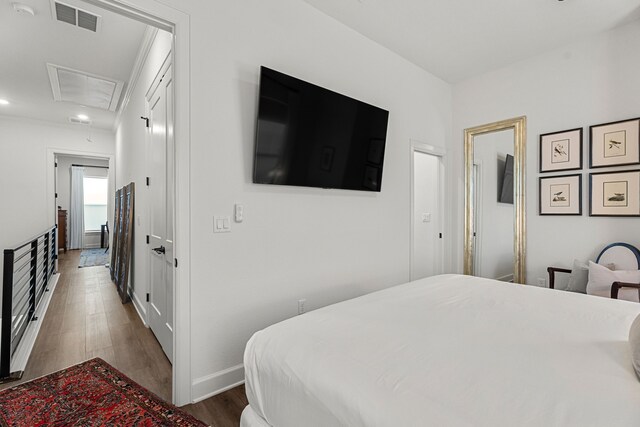 bedroom featuring dark wood-type flooring