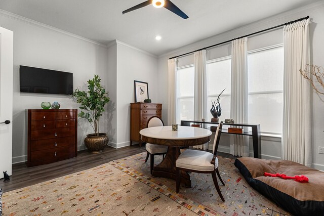 interior space featuring ceiling fan, dark hardwood / wood-style flooring, and ornamental molding