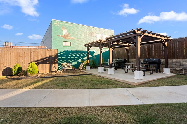 view of patio with a pergola and area for grilling