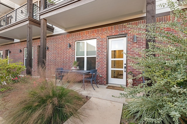 doorway to property featuring a balcony