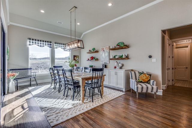 dining area featuring crown molding and dark hardwood / wood-style floors