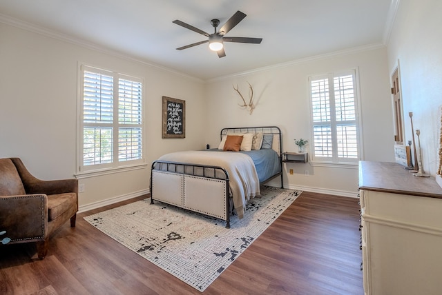 bedroom featuring hardwood / wood-style flooring, ceiling fan, and crown molding