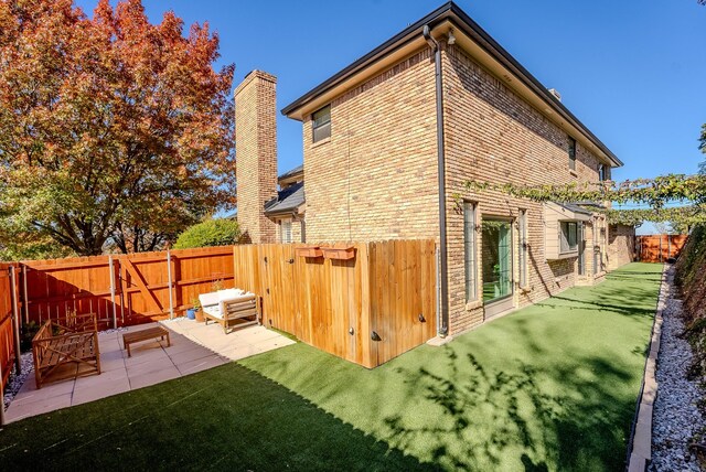 back of property featuring a patio area