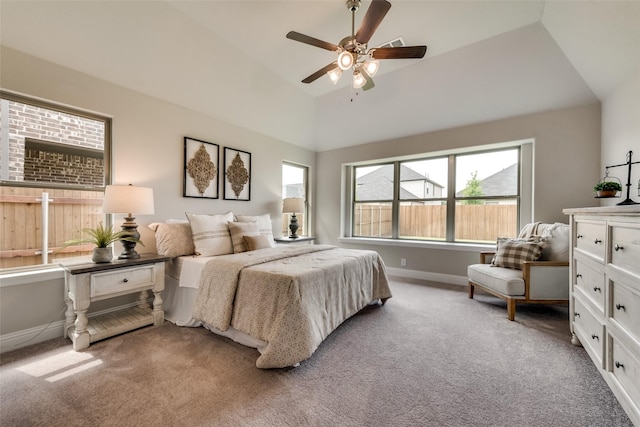 carpeted bedroom featuring vaulted ceiling and ceiling fan