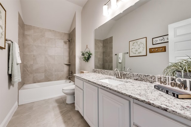 full bathroom with vanity, tile patterned floors, tiled shower / bath, vaulted ceiling, and toilet