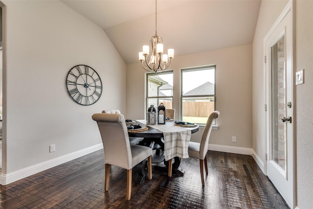 dining space with a notable chandelier, lofted ceiling, and dark wood-type flooring