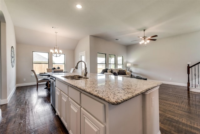 kitchen with a kitchen island with sink, plenty of natural light, white cabinets, and sink