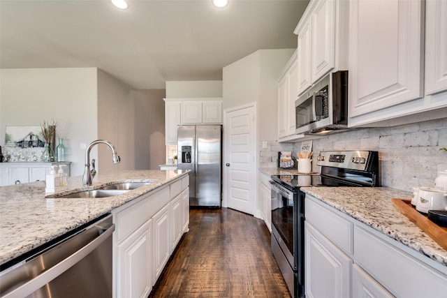 kitchen with white cabinets, stainless steel appliances, dark hardwood / wood-style floors, and sink