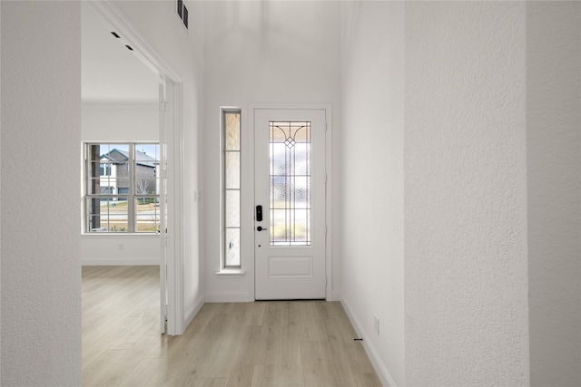 entryway with light hardwood / wood-style floors