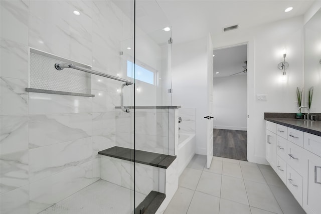 bathroom with tile patterned floors, vanity, ceiling fan, and independent shower and bath