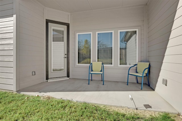 doorway to property featuring a patio area